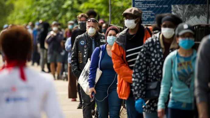 美国今日疫情挑战与希望的并存状态报道